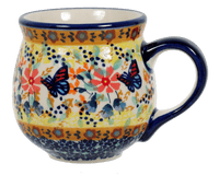 A picture of a Polish Pottery Medium Belly Mug (Butterfly Bliss) | K090S-WK73 as shown at PolishPotteryOutlet.com/products/the-medium-belly-mug-butterfly-bliss