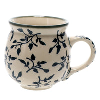 A picture of a Polish Pottery Medium Belly Mug (Green Spray) | K090T-LISZ as shown at PolishPotteryOutlet.com/products/the-medium-belly-mug-green-spray
