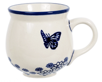 A picture of a Polish Pottery Medium Belly Mug (Butterfly Garden) | K090T-MOT1 as shown at PolishPotteryOutlet.com/products/the-medium-belly-mug-butterfly-garden