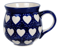 A picture of a Polish Pottery Medium Belly Mug (Sea of Hearts) | K090T-SEA as shown at PolishPotteryOutlet.com/products/the-medium-belly-mug-sea-of-hearts