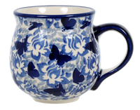 A picture of a Polish Pottery Medium Belly Mug (Dusty Blue Butterflies) | K090U-AS56 as shown at PolishPotteryOutlet.com/products/the-medium-belly-mug-dusty-blue-blossoms-1