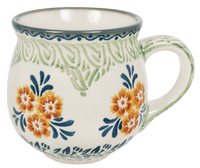 A picture of a Polish Pottery The Medium Belly Mug (Green Floral Splash) | K090U-KLB as shown at PolishPotteryOutlet.com/products/the-medium-belly-mug-green-floral-splash