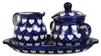 A picture of a Polish Pottery Cream and Sugar Set (Torrent of Hearts) | K091T-SEM as shown at PolishPotteryOutlet.com/products/cream-and-sugar-set-torrent-of-hearts