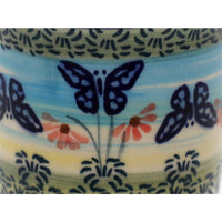 A picture of a Polish Pottery Wine Cup/Q-Tip Holder (Butterflies in Flight) | K100S-WKM as shown at PolishPotteryOutlet.com/products/wine-cup-q-tip-holder-butterflies-in-flight-k100s-wkm