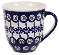 A picture of a Polish Pottery The Large Mars Mug (Floral Peacock) | K106T-54KK as shown at PolishPotteryOutlet.com/products/the-large-mars-mug-floral-peacock