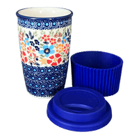 A picture of a Polish Pottery Travel Mug (Festive Flowers) | K115S-IZ16 as shown at PolishPotteryOutlet.com/products/travel-mug-festive-flowers-k115s-iz16