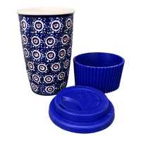 A picture of a Polish Pottery Travel Mug (Bonbons) | K115T-2 as shown at PolishPotteryOutlet.com/products/travel-mug-bonbons-k115t-2