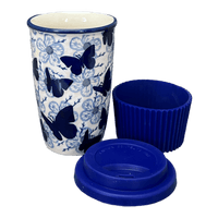 A picture of a Polish Pottery Travel Mug (Blue Butterfly) | K115U-AS58 as shown at PolishPotteryOutlet.com/products/travel-mug-blue-butterfly-k115u-as58