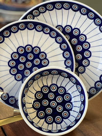 A picture of a Polish Pottery 5.5" Bowl (Peacock in Line) | M083T-54A as shown at PolishPotteryOutlet.com/products/55-bowls-peacock-in-line