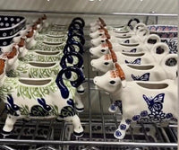 A picture of a Polish Pottery Cow Creamer (Bonbons) | D081T-2 as shown at PolishPotteryOutlet.com/products/cow-creamer-2-d081t-2