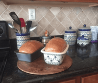 A picture of a Polish Pottery Bread Baker (Floral Peacock) | Z150T-54KK as shown at PolishPotteryOutlet.com/products/bread-server-floral-peacock