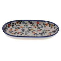 A picture of a Polish Pottery WR 7" x 11" Oval Roaster (Rainbow Shower) | WR13B-NP18 as shown at PolishPotteryOutlet.com/products/7-x-11-oval-roaster-np18