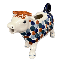 A picture of a Polish Pottery Cow Creamer (Fall Confetti) | D081U-BM01 as shown at PolishPotteryOutlet.com/products/cow-creamer-fall-confetti-d081u-bm01